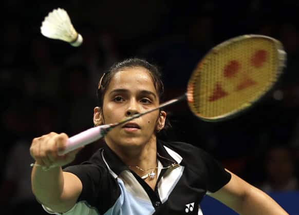 Saina Nehwal returns the shuttlecock to Germany`s Julianne Schenk during their women`s singles semifinal match at the Indonesia Open badminton championship at Istora stadium in Jakarta.