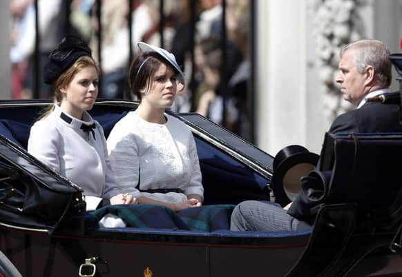 Britain`s Princess Beatrice, Princess Eugenie, Prince Andrew leave Buckingham Palace in a horse drawn carriage for the Trooping The Colour parade, at the Horse Guards Parade in London.
