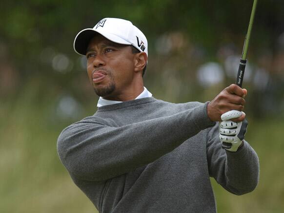 Tiger Woods watches his shot on the 13th hole during the second round of the US Open golf tournament at Merion Golf Club in Ardmore, Pa.