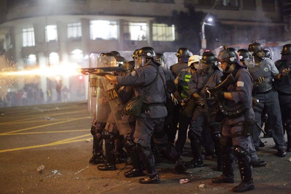Police fire rubber bullets at demonstrators protesting a price increase for public transportation in Sao Paulo, Brazil.