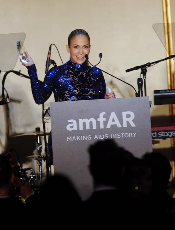 Actress Jennifer Lopez accepts the Humanitarian Award at the amfAR Inspiration Gala at the The Plaza Hotel in New York.