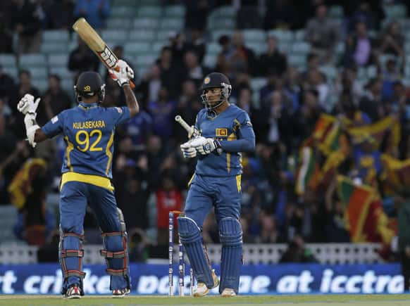 Sri Lanka`s Kumar Sangakkara and teammate Nuwan Kulasekera celebrate after they defeated England in their ICC Champions Trophy cricket match at the Oval cricket ground in London.