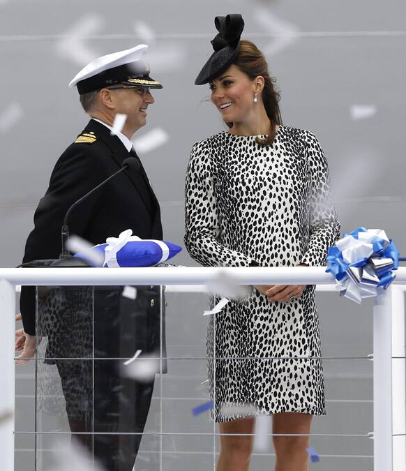 Britain`s Kate, the Duchess of Cambridge smiles at Captain Tony Draper during a naming ceremony for the `Royal Princess` cruise ship in Southampton, England.