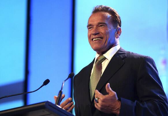 Former Governor of California Arnold Schwarzenegger gestures while he delivers a speech during a Financial Education Summit in Sydney, Australia.