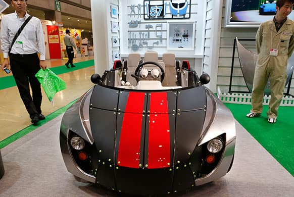 Toyota Motor Co.`s Camatte 57s electric car is displayed at the Tokyo Toy Show in Tokyo. Toyota designed the three-seater concept car for children to drive only on private property.