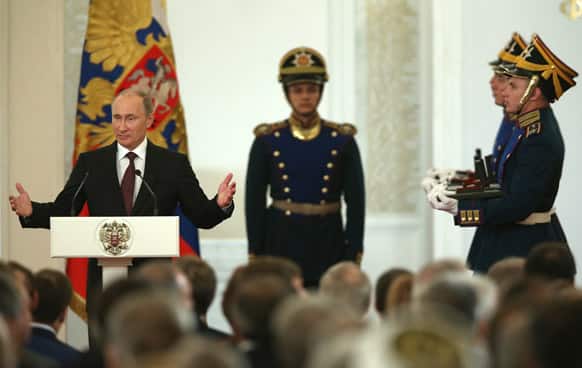 Russian President Vladimir Putin speaks at the Kremlin`s St.George`s Hall during the awarding ceremony at the Day of Russia.