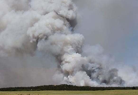 A fire burns out of control north of Shoupe Road and East of Highway 83 in Colorado Springs, Colo.