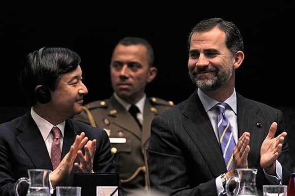 Spain`s Crown Prince Felipe, right, and Japan`s Crown Prince Naruhito, left, clap hands during the opening of Spanish-Japanese Business Cooperation Meeting at the House of Mint in Madrid.