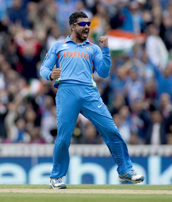 Ravindra Jadeja celebrates taking the wicket of West Indies` Johnson Charles, not pictured, during the ICC Champions Trophy group B cricket match between India and West Indies at The Oval cricket ground in London.
