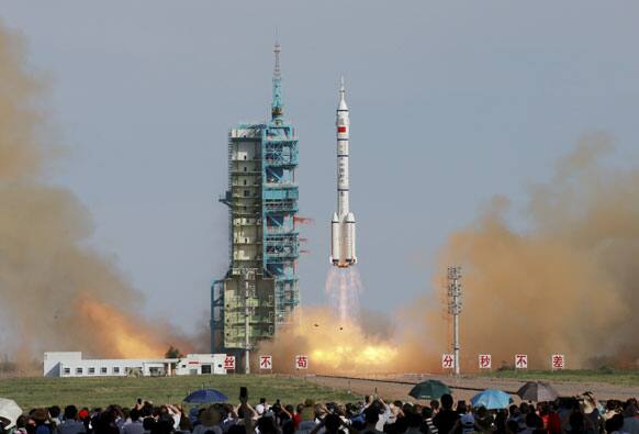 This photo released by China`s Xinhua news agency, the Long March-2F rocket carrying China`s manned Shenzhou-10 spacecraft blasts off from the launch pad at the Jiuquan Satellite Launch Center in Jiuquan, northwest China`s Gansu Province.