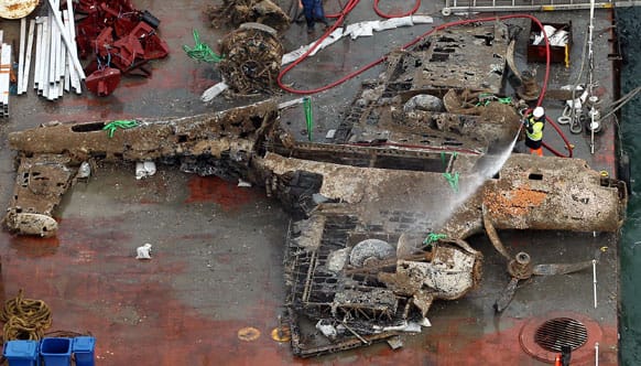The remains of a crashed World War II Dornier bomber, the only surviving German Second World War Dornier Do 17 bomber, lays on a barge near Deal in the English Channel, after being raised from the sea bed Monday evening.