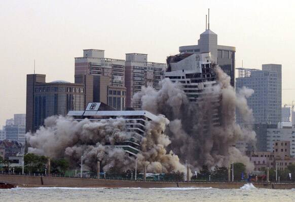 A 27-year old hotel is demolished by explosives to make way for redevelopment on the water front in Qingdao in eastern China`s Shandong province.