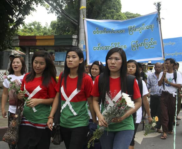 Activists wearing T-shirt with the flag of Kachin Independence Army (KIA), march during a ceremony to commemorate the 2nd anniversary of the fighting between Myanmar government troops and KIA, in Yangon, Myanmar.