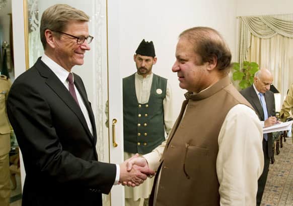 Visiting German Foreign Minister Guido Westerwelle shakes hand with Pakistan`s Prime Minister Nawaz Sharif prior to their meeting in Islamabad, Pakistan.