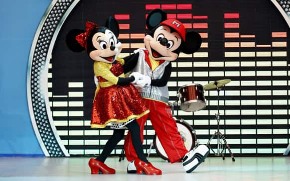 Popular Disney characters Minnie Mouse and Micky Mouse perform during