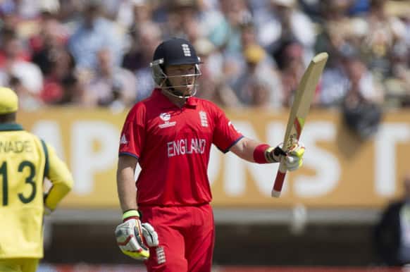 England`s Ian Bell holds up his bat to acknowledge reaching 50 runs during the ICC Champions Trophy group A cricket match between England and Australia at Edgbaston cricket ground in Birmingham, England.
