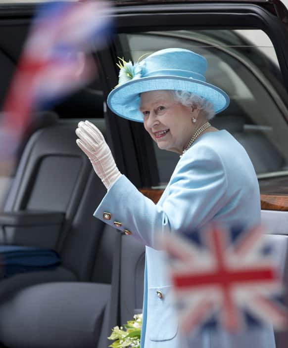 Britain`s Queen Elizabeth II waves after officially opening the headquarters of the British Broadcasting Corporation`s new Broadcasting House in central London.