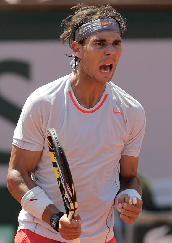 Spain`s Rafael Nadal reacts as he plays Serbia`s Novak Djokovic during their semifinal match of the French Open tennis tournament at the Roland Garros stadium in Paris.