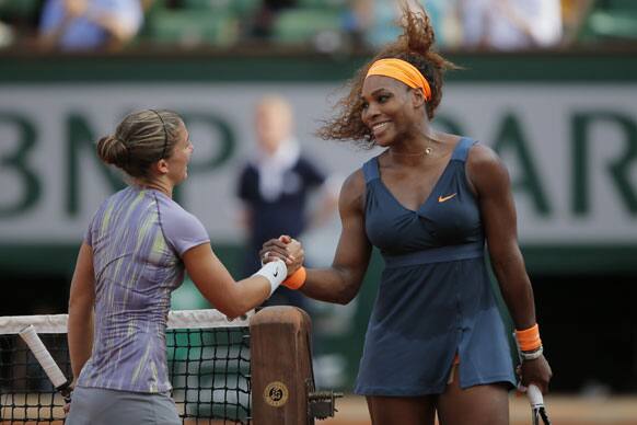 Serena Williams of the US, shakes hands with Italy`s Sara Errani after defeating Errani in two sets 6-0, 6-1, in their semifinal match at the French Open tennis tournament, at Roland Garros stadium in Paris.