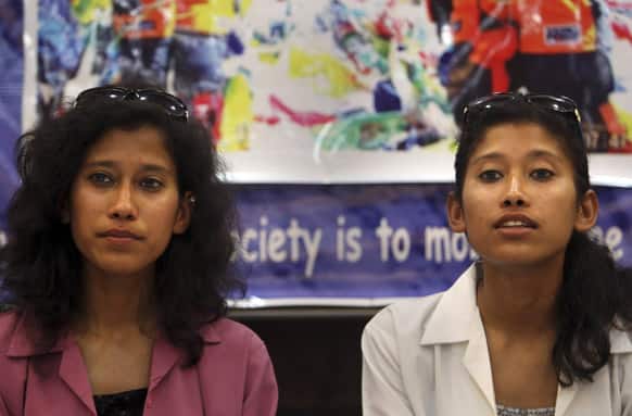 Nungshi Malik, left, and and her twin sister Tashi Malik, listen to a question during a press conference in New Delhi. Nungshi and Tashi became the first set of twin sisters to scale Mount Everest on May 19, 2013, according to local reports.