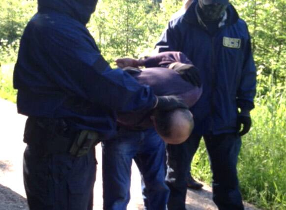 This grab made from video provided by the Russia’s counter-terrorism agency on Thursday, June 6, 2013, special forces arrest a man Thursday the agency says planned a terrorist attack on Moscow that the agency foiled last month.