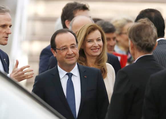 French President Francois Hollande and his companion Valerie Trierweiler arrive at Haneda airport in Tokyo.