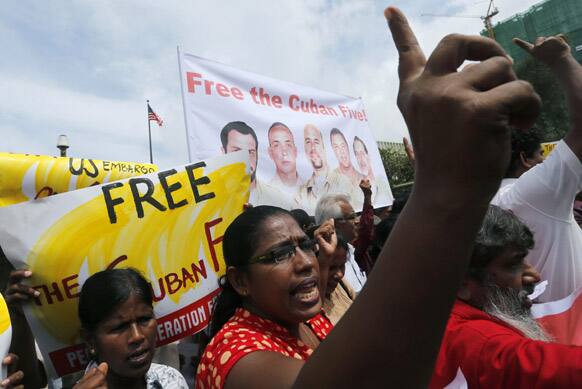 Members of Sri Lanka`s Marxist political party, People`s Liberation Front, shout anti US slogans during a protest outside the US Embassy in Colombo, Sri Lanka. The protestors were demonstrating over the detention of five Cuban nationals in the US and extended their support to Cuba.