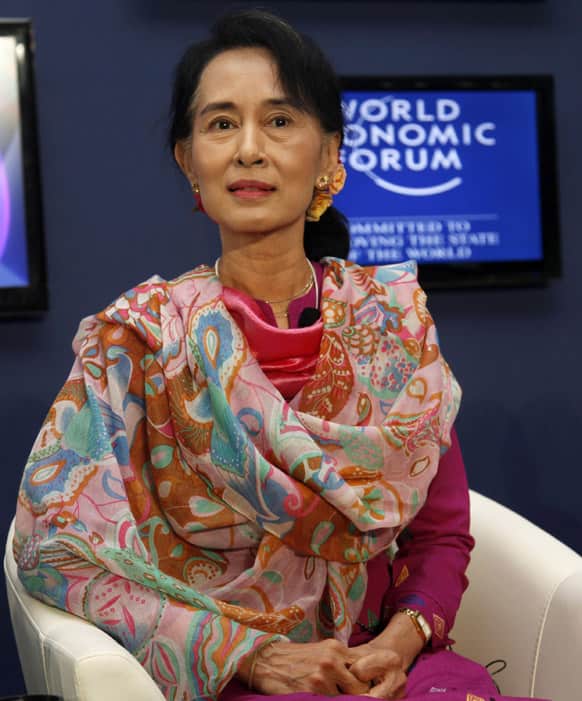 Myanmar opposition leader Aung San Suu Kyi attends a debate with Myanmar President`s Office Minister Soe Thane on the second day of the three-day World Economic Forum on East Asia at Myanmar International Convention Center in Naypyitaw, Myanmar.