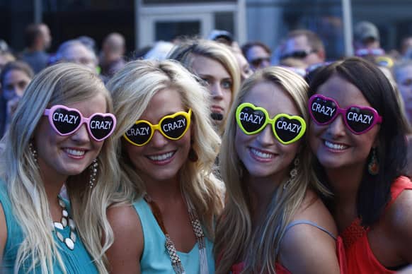 Fans wearing sunglasses promoting Hunter Hayes` song