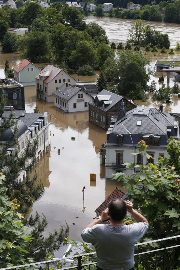 A man looks looks at the flooded streets of the city of Bad Schandau near the German Czech boarder in Saxony, Germany. Heavy rainfalls caused flooding in parts of Germany, Austria and Czech Republic.