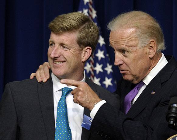 Vice President Joe Biden stands with former Rhode Island Rep. Patrick Kennedy, as he speaks at the closing of the National Conference on Mental Health, in the South Court Auditorium on the White House complex in Washington.