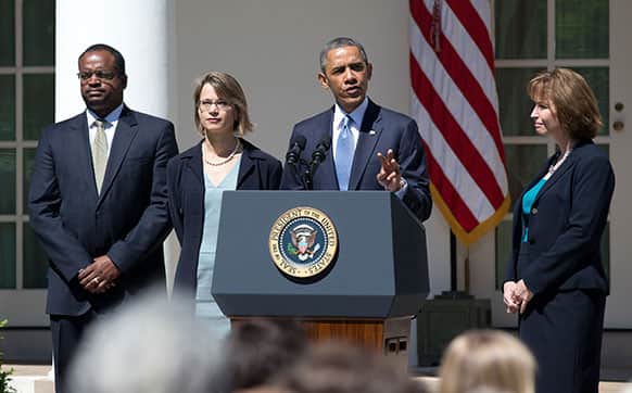 President Barack Obama speaks in the Rose Garden of the White House in Washington, to announced the nominations of, from left, Robert Wilkins, Cornelia Pillard, and Patricia Ann Millet, to the US Court of Appeals for the District of Columbia Circuit.