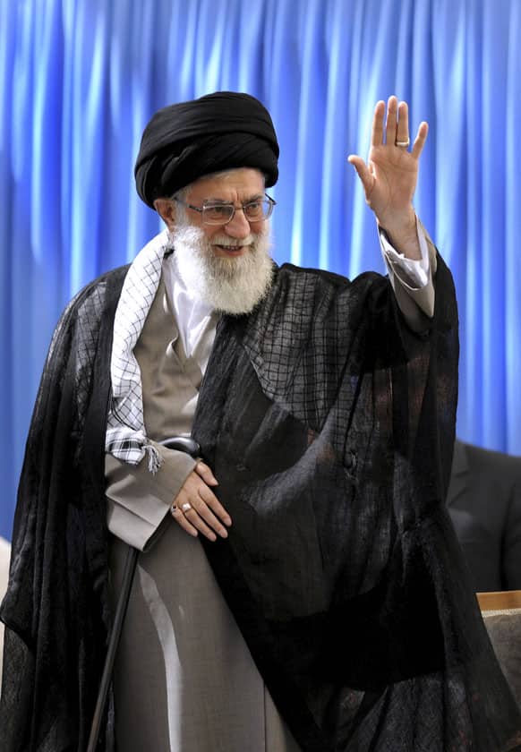 Supreme Leader Ayatollah Ali Khamenei waves to the crowd in a ceremony marking the anniversary of the death of the late revolutionary founder Ayatollah Khomeini at his shrine just outside Tehran, Iran.