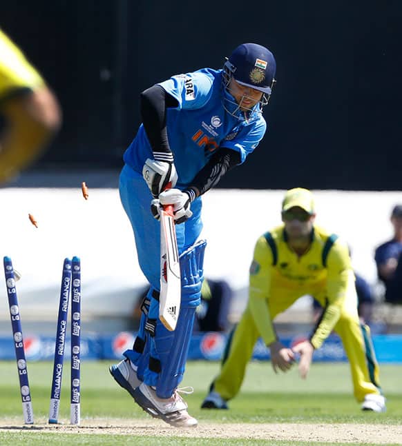India`s Suresh Raina is bowled for no score off the bowling of Australia`s Clint McKay during a warm up cricket match for the upcoming ICC Champions Trophy between India and Australia at the Cardiff Wales Stadium in Cardiff.