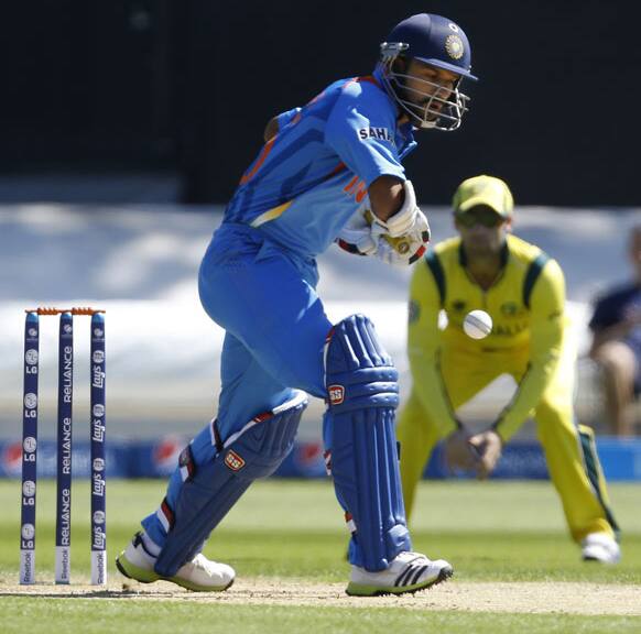 Shikhar Dhawan plays a shot off the bowling of Australia`s Mitchell Starc during a warm up cricket match for the upcoming ICC Champions Trophy between India and Australia at the Cardiff Wales Stadium in Cardiff.