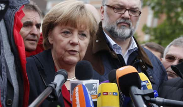 German Chancellor Angela Merkel addresses the media during her short visit of the flooded old town of Passau at Danube river, southern Germany.