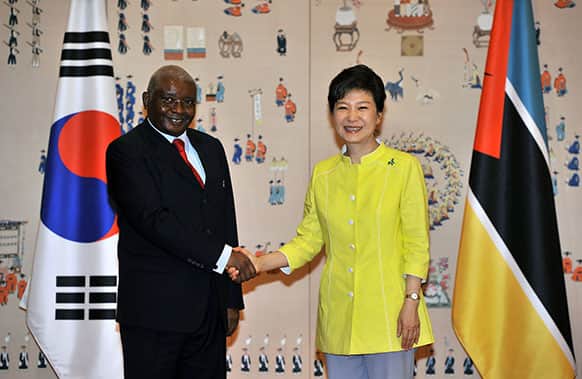 South Korean President Park Geun-hye, right, shakes hands with Mozambique`s President Armando Guebuza before a meeting at the presidential Blue House in Seoul, South Korea.