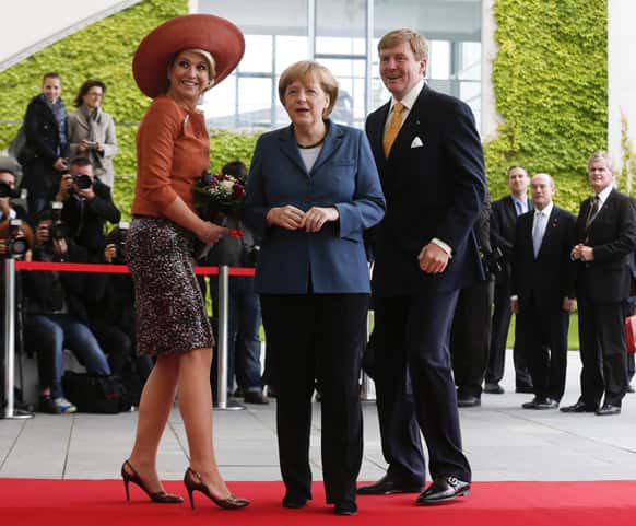 German Chancellor Angela Merkel, welcomes King Willem-Alexander of the Netherlands and Queen Maxima, for a meeting at the chancellery in Berlin.