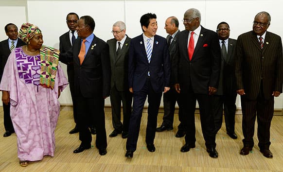 Japanese PM Shinzo Abe, escorts Sierra Leone`s President Ernest Bai Koroma, Chairperson of the African Union Commission Nkosazana Dlamini-Zuma, and other representatives from African countries prior to the Japan-Africa summit meeting on United Nations Security Council reform at the TICAD.