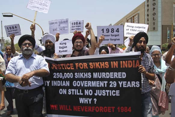 Sikhs march demanding punishment for those responsible for the 1984 anti-Sikh riots during a protest in Ahmadabad. Sikhs resumed protests after an Indian court acquitted Sajjan Kumar of charges he incited mobs to kill Sikhs during the riots when more than 3,000 Sikhs were killed.