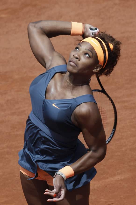 Serena Williams of the US serves against Italy`s Roberta Vinci in their fourth round match at the French Open tennis tournament, at Roland Garros stadium in Paris.