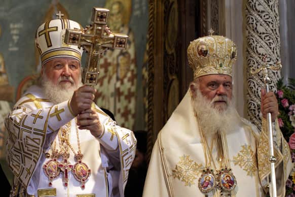 Russian Orthodox Patriarch Kirill I, left, and Archbishop of Athens Ieronimos, lead a Sunday mass at the church of Agios Panteleimonas in Athens.