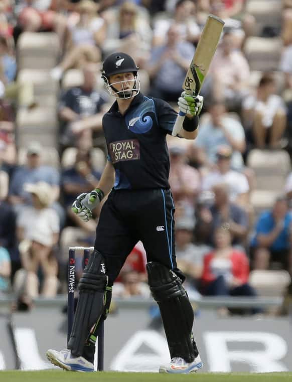 New Zealand`s Martin Guptill, raises his bat as he acknowledges the crowd for reaching fifty runs, during their second one day international cricket match against England, at the Ageas Bowl in Southampton, England.
