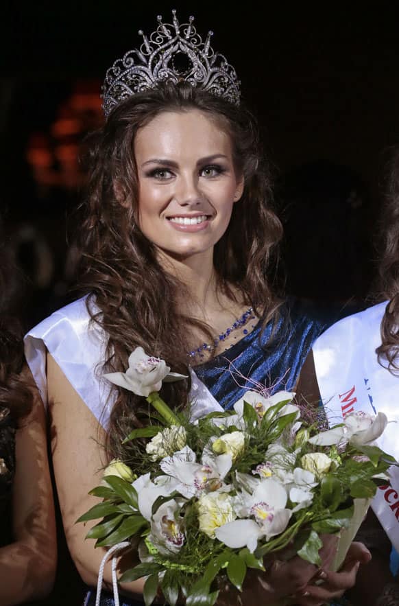 Daria Ulyanova, 21, from Moscow, poses for photographers after she was named as the winner of