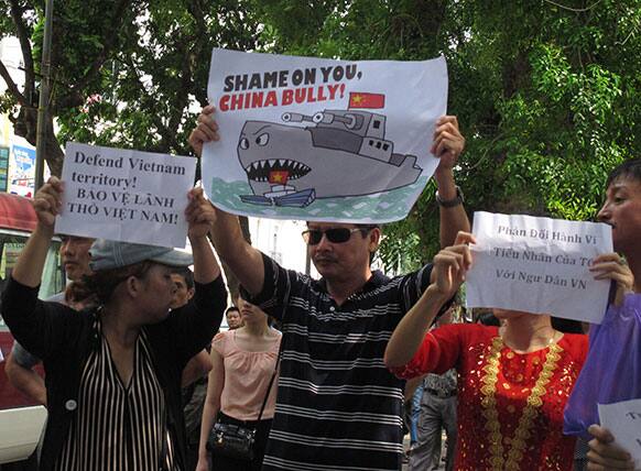 Nationalist protestors hold up banners demonstrating Chinese territorial assertiveness in the South China Sea.