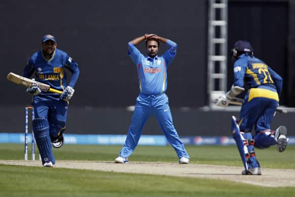 Amit Mishra reacts to his missed chance to take the the wicket of Sri Lanka`s Mahela Jayawardane, during the ICC Champions Trophy warm-up cricket match at Edgbaston cricket ground in Birmingham, England.