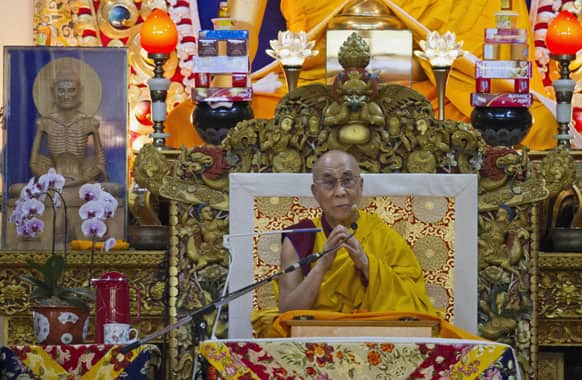 Tibetan spiritual leader the Dalai Lama gives a religious talk at the Tsuglakhang temple in Dharmsala.