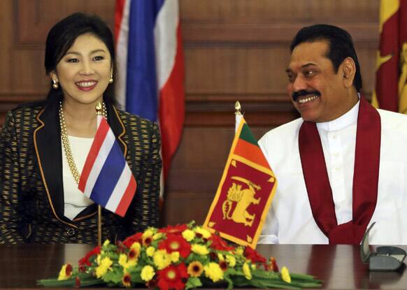 Thailand`s Prime Minister Yingluck Shinawatra and Sri Lanka’s President Mahinda Rajapaksa smile after their meeting in Colombo, Sri Lanka. Yingluck arrived in Sri Lanka Friday for a two-day official visit aimed at strengthening bilateral relations.