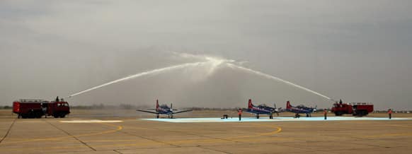 Pilatus PC-7 Swiss made planes are sprayed with water during the Induction Ceremony at Dundigal, 40 kilometers (25 miles) from Hyderabad. Ten PC-7s have been inducted into Indian Air Force (IAF) as the Basic trainer for new pilots.