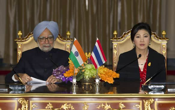 India`s Prime Minister Manmohan Singh speaks during a joint press conference with Thailand`s Prime Minister Yingluck Shinawatra at the government house in Bangkok, Thailand. Singh is on a two-day visit to Thailand.